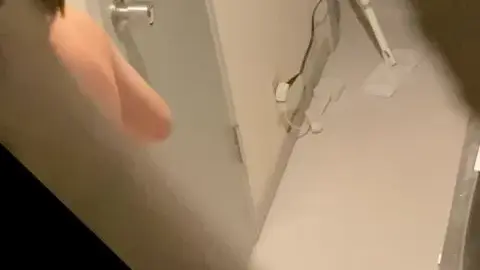 Asian Beauty in Dimly Lit Bathroom