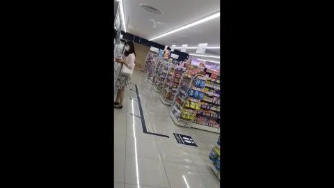 Asian Girl Exposes Buttocks in Store