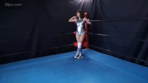 Asian Wrestlers in Silver Costumes Engage in Intimate Match