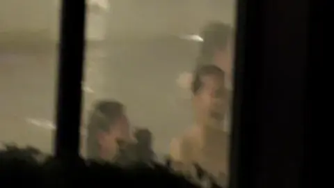 Asian Girls in Dimly Lit Bathroom