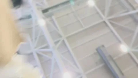 Slender Caucasian Woman in White Ruffled Dress