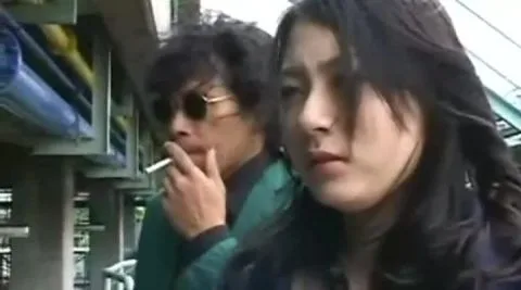 Asian Women in Futuristic Costumes Engage in Intimate Encounters