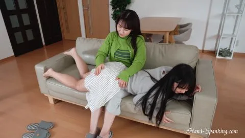 Asian Lesbians Spanking in Living Room