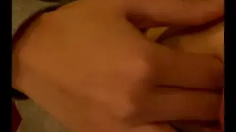 Slim Caucasian Woman Masturbates in Dim Bedroom