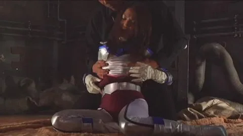 Asian Performers in Metallic Costumes Engage in Oral Sex