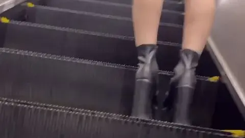 Brunette in Gray Skirt on Escalator and Stairs POV