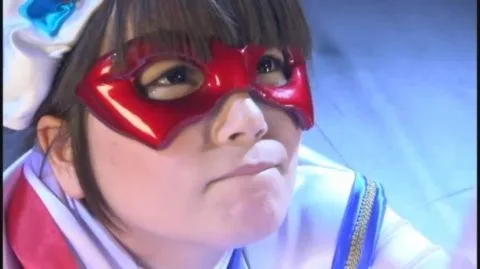 Asian Performer in Red Mask and White Costume