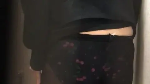 Brunette in Lingerie in Dimly Lit Closet