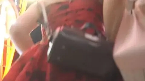 Asian teen in red dress poses