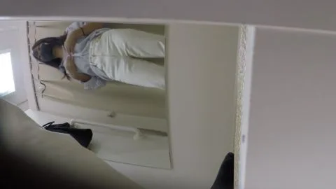 Asian Teen Undresses in Bedroom