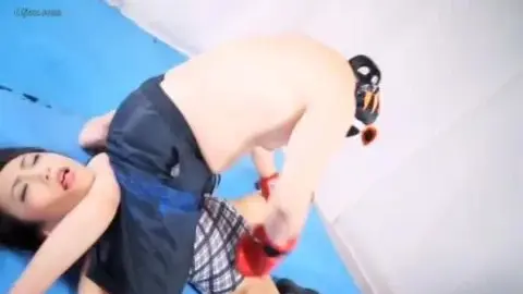 Asian Couple Wrestling in Boxing Gloves