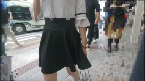 Asian Girl in Black Skirt on City Street