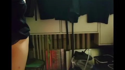 Slim Caucasian Girl Exposes Herself in Cluttered Room