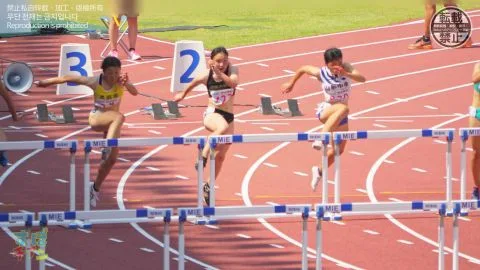 Asian Athletes in Sports Uniforms Hurdle Racing