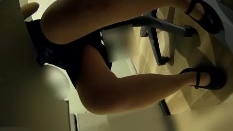 Slim Caucasian Woman in Black Dress Office Scene